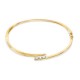 Pulsera rígida bañada en oro y trilogía de circonitas
