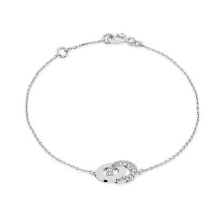 Pulsera en oro blanco 9K con dos aros entrelazados  uno con circonitas