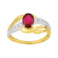 Anillo de oro bicolor circonita y rubí entrelazados
