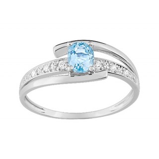 Anillo de oro blanco 9K circonitas laterales y topacio