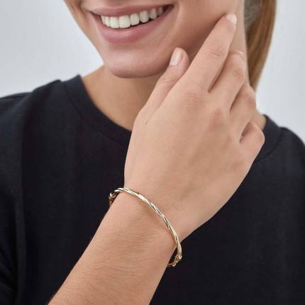 Pulseira retorcida em ouro amarelo 9K rígida