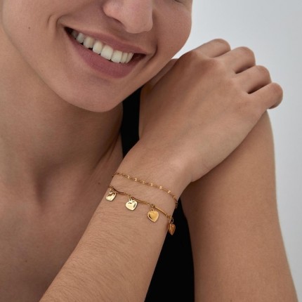 Pulseira em aço dourado com coração e chapas de 16+3 cm