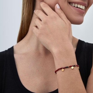 Pulseira em aço dourado com bolas cinzentas e chapas