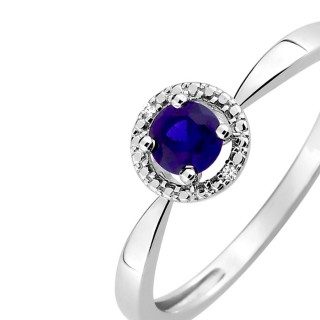Anillo de oro blanco 9K con zafiro central y circonitas