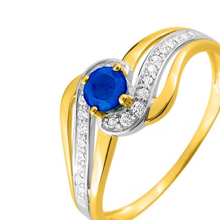 Anillo de oro bicolor entrelazado de zafiro