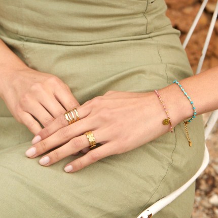 Anel ajustável em aço dourado com motivo de folhas