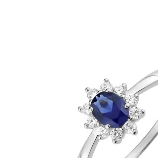 Anel solitário com flor de prata 925 banhada a ródio e zircónias azul e branca