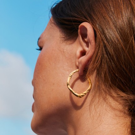 Pendientes de medio aro en acero dorado