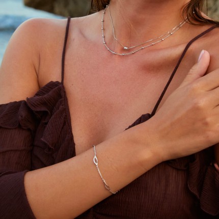 Pulsera de plata 925 rodiada adornada con 4 motivos