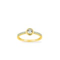 Anillo solitario acompañado de oro amarillo 9K con topacio azul tratado