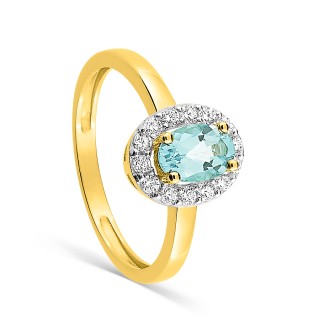 Anillo de oro amarillo de 9K adornado con una aguamarina ovalada y varias circonitas sobre rodio