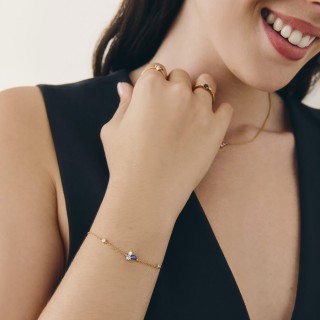 Pulsera bañada en oro con circonitas azul cielo y blancas