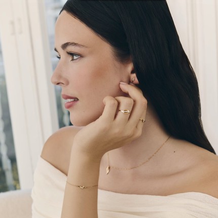 Pulseira onda em ouro amarelo 18K com diamantes de 0,02 ct