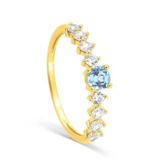 Anillo de oro amarillo de 9K con topacio azul redondo y circonitas blancas redondas