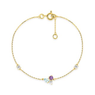 Pulsera de oro amarillo de 9K con un trío de piedras que incluyen iolita, topacio azul tratado y circonita