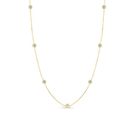 Collar de cadena tipo curb de oro amarillo 9K con 7 circonitas cúbicas engastadas en bisel
