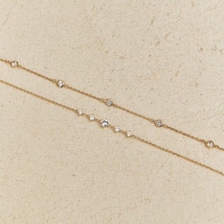 Pulsera bañada en oro con circonitas cúbicas blancas y azul claro