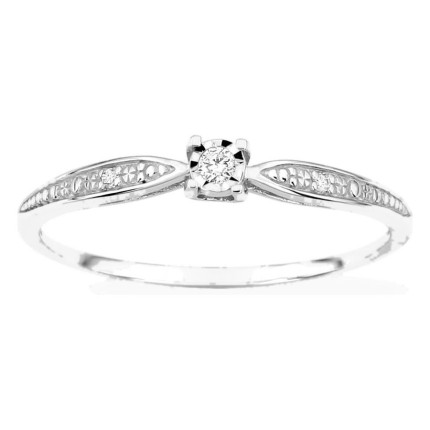 Anillo solitario con piedras laterales en oro blanco 750 ‰ y diamantes en chatón ilusión de 0,03 ct